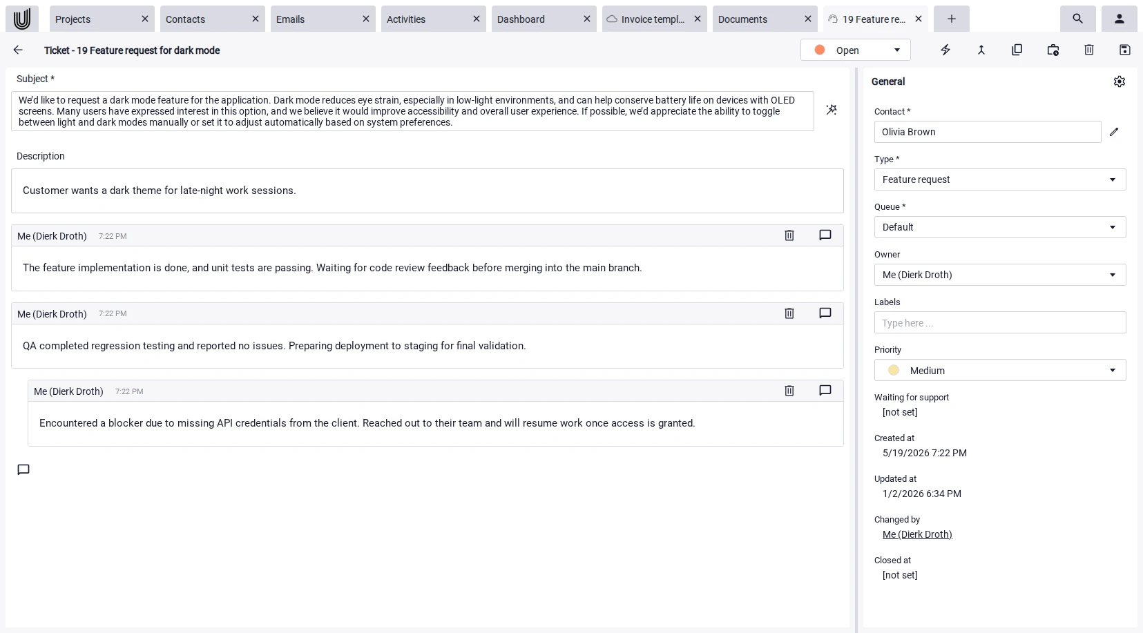 Project management with AI suggesting automatic ticket replies.